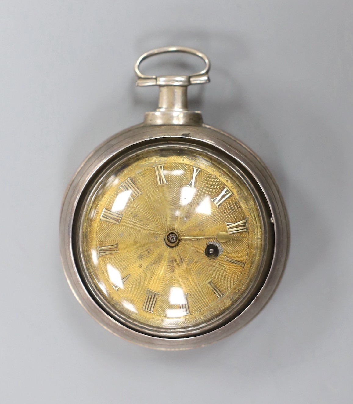 A George III silver pair cased keywind pocket watch, by Barnett of Hereford, with Roman dial and lacking one hand, outer case diameter 55mm.